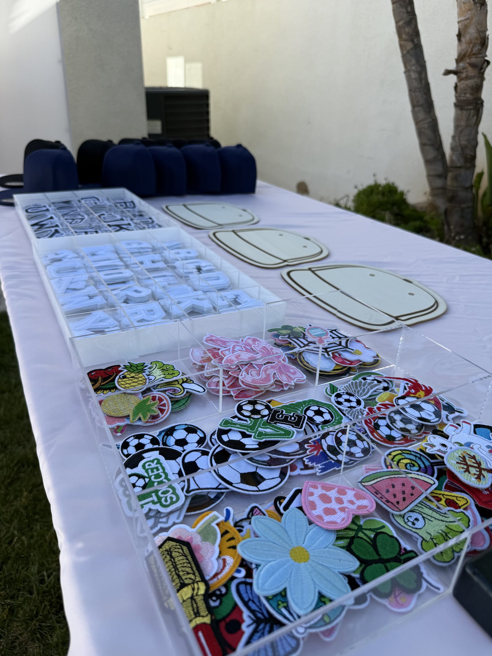 The Heat Press Bar at a Los Angeles kids' birthday party — A grown-up favorite. Each child selects a hat, t-shirt, or tote — picks their na