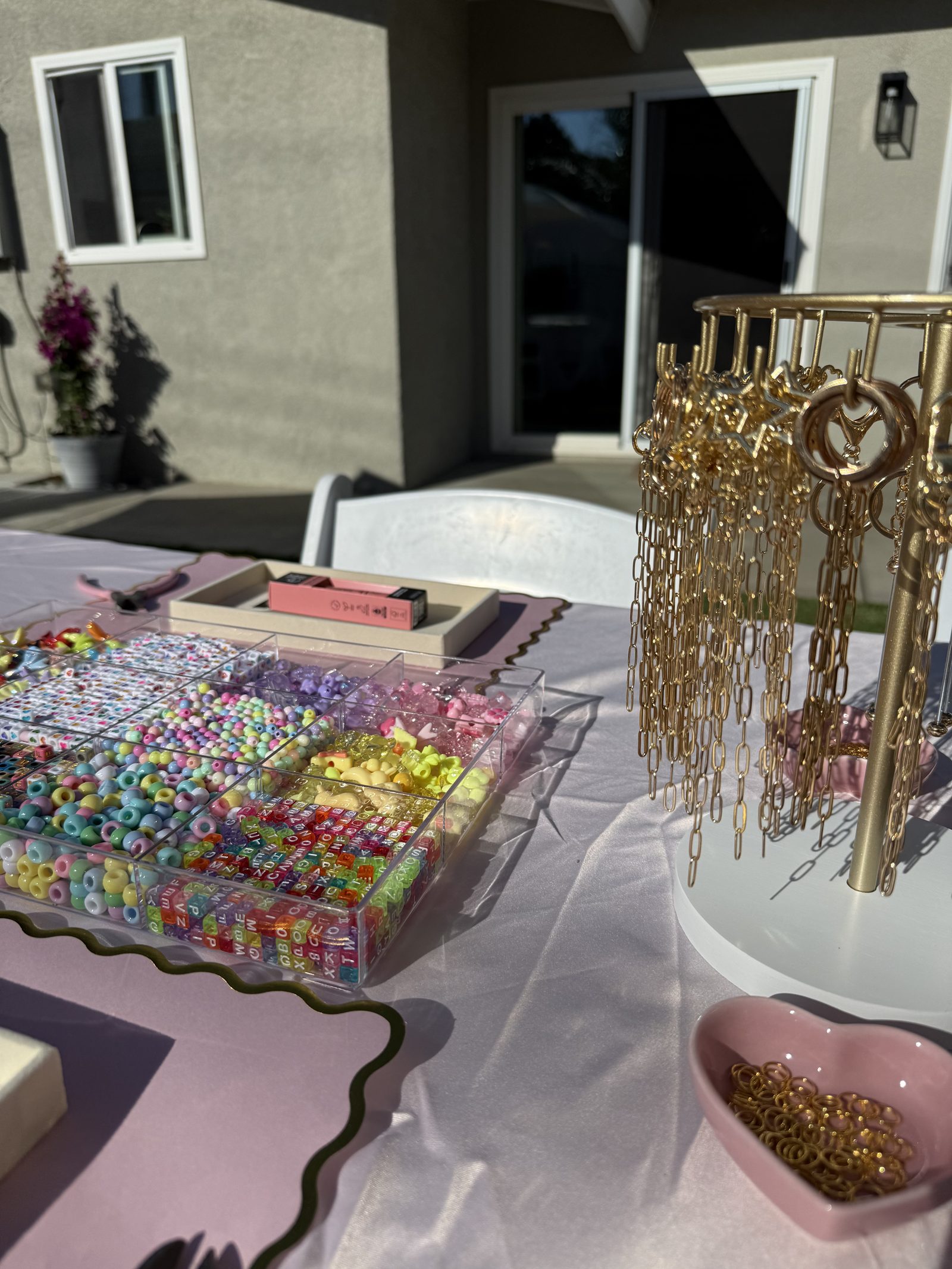 The Lip Gloss & Keychain Bar at a Los Angeles kids' birthday party — Two beloved experiences in one. Kids design beaded keychains from a curated past