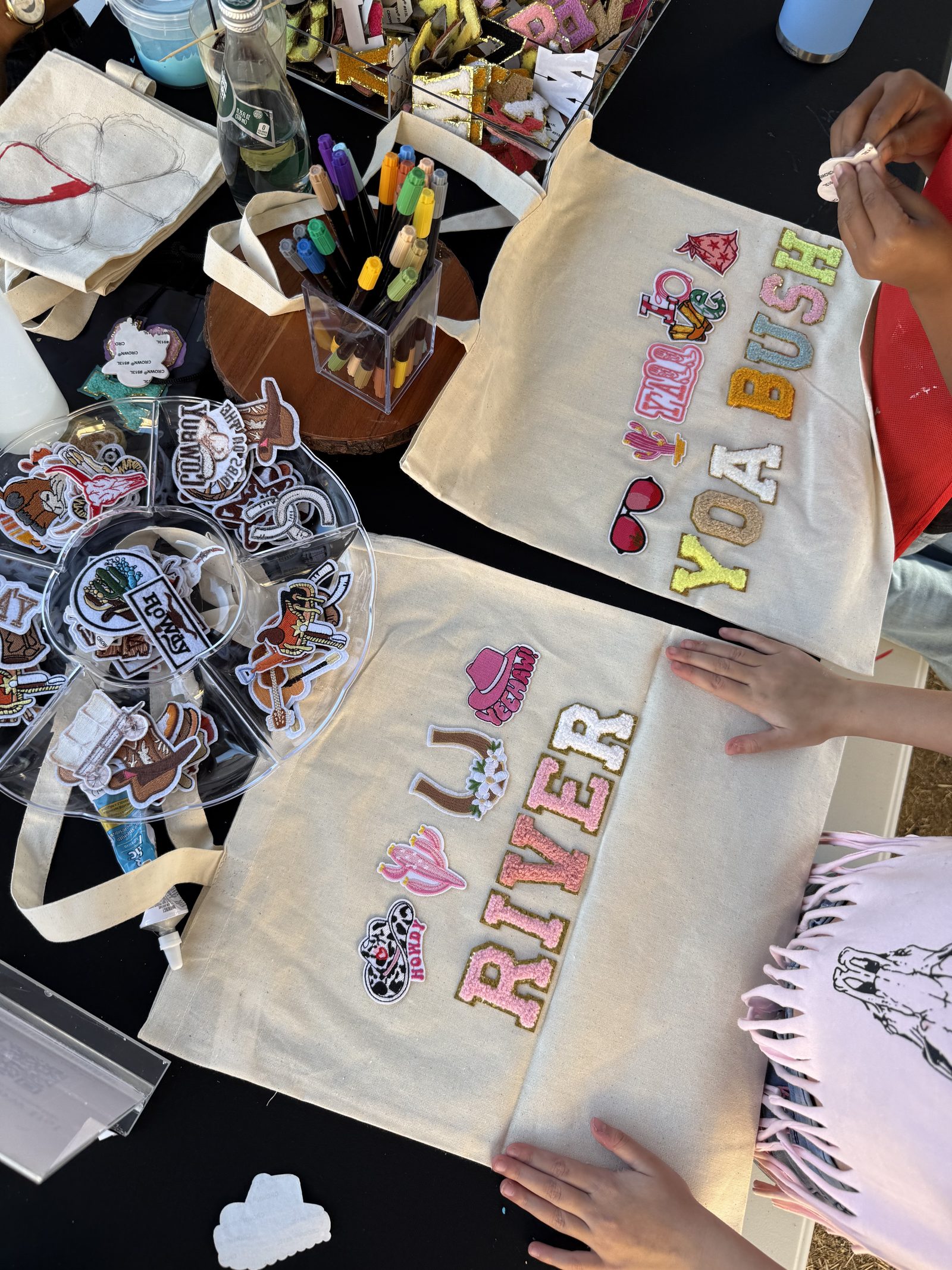 The Patch Bar at a Los Angeles kids' birthday party — A signature experience. Each guest customizes a canvas tote, cosmetic bag, or de